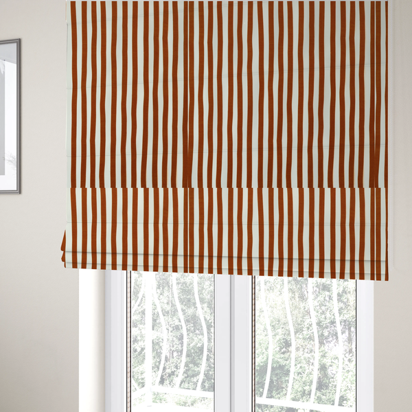 The fabric used to create these Roman blinds is a white fabric patterned with vertical, hand-drawn brown stripes that feature a slight, organic waviness.