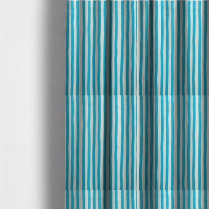 The fabric used to create these made-to-measure curtains is a white fabric patterned with vertical, hand-drawn light blue stripes that feature a slight, organic waviness.