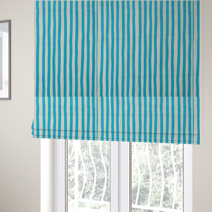 The fabric used to create these Roman blinds is a white fabric patterned with vertical, hand-drawn light blue stripes that feature a slight, organic waviness.