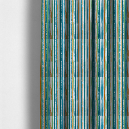 The fabric used to create these made-to-measure curtains is a white fabric patterned with multi-coloured vertical, hand-drawn stripes in teal, green, blue, and orange with a slight, organic waviness.