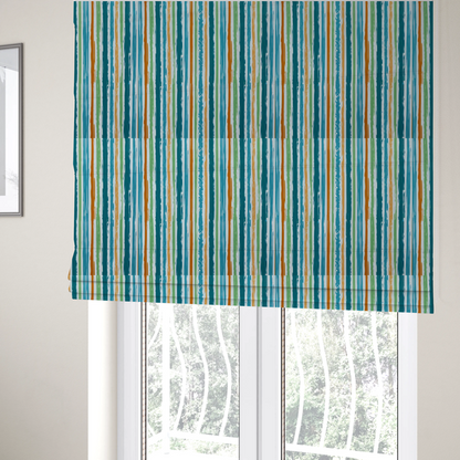 The fabric used to create these Roman blinds is a white fabric patterned with multi-coloured vertical, hand-drawn stripes in teal, green, blue, and orange with a slight, organic waviness.