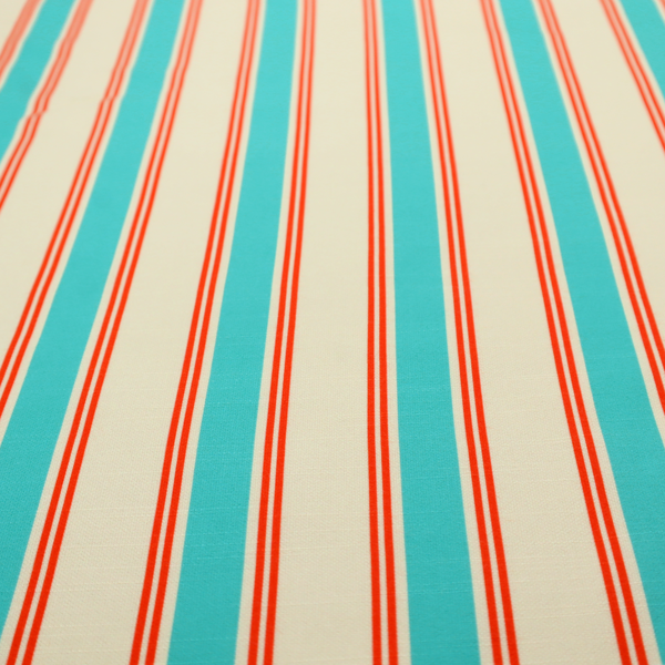 A white fabric patterned with vertical, hand-drawn turquoise and red double stripes that feature a slight, organic waviness.