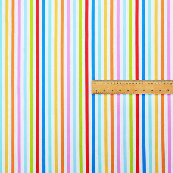 A white fabric patterned with horizontal, hand-drawn multi-coloured stripes in pink, blue, green, red, yellow, and orange that feature a slight, organic waviness.   