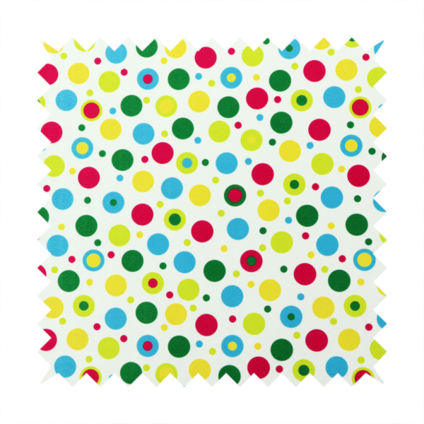 A playful fabric pattern featuring scattered polka dots and concentric circles in various sizes and colours, including pink, blue, green, yellow, and lime on a white background.