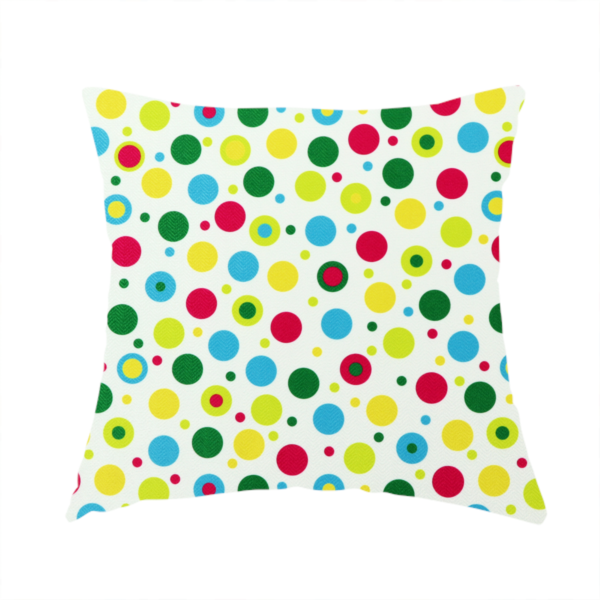 The fabric used to create this handmade cushion is a playful fabric pattern featuring scattered polka dots and concentric circles in various sizes and colours, including pink, blue, green, yellow, and lime on a white background.