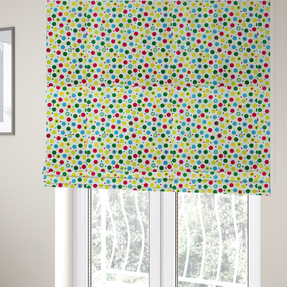 The fabric used to create these Roman blinds is a playful fabric pattern featuring scattered polka dots and concentric circles in various sizes and colours, including pink, blue, green, yellow, and lime on a white background.
