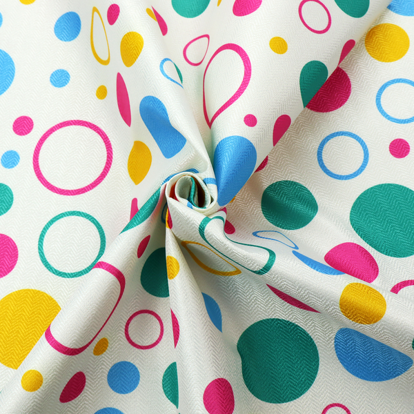 A fun and colourful fabric pattern featuring random solid and hollow polka dots in pink, teal, yellow, and blue on a white background.