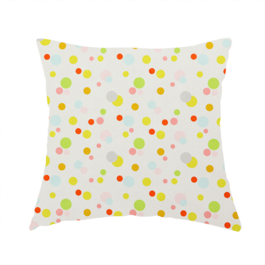 The fabric used to create this handmade cushion is a subtle fabric pattern featuring scattered pastel and bright polka dots in shades of yellow, orange, light green, grey, and soft blue on a white background.