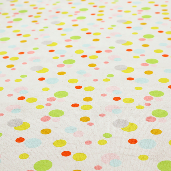 A subtle fabric pattern featuring scattered pastel and bright polka dots in shades of yellow, orange, light green, grey, and soft blue on a white background.
