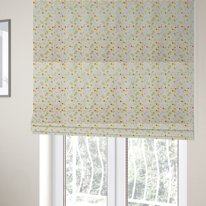 The fabric used to create these Roman blinds is a subtle fabric pattern featuring scattered pastel and bright polka dots in shades of yellow, orange, light green, grey, and soft blue on a white background.