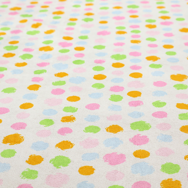 A whimsical fabric pattern featuring scattered painterly dots in soft shades of pink, yellow, lime green, and light blue on a white background.