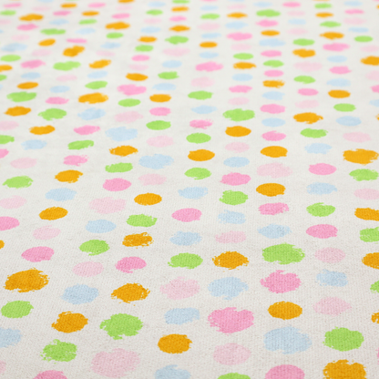 A whimsical fabric pattern featuring scattered painterly dots in soft shades of pink, yellow, lime green, and light blue on a white background.