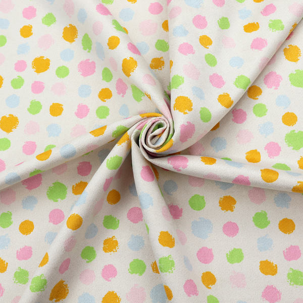 A whimsical fabric pattern featuring scattered painterly dots in soft shades of pink, yellow, lime green, and light blue on a white background.