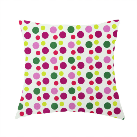 The fabric used to create this handmade cushion is a playful fabric pattern featuring neat vertical rows of alternating polka dots in shades of magenta, pink, green, and lime on a white background.