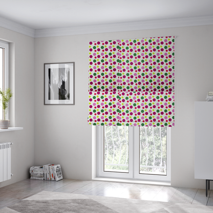The fabric used to create these Roman blinds is a playful fabric pattern featuring neat vertical rows of alternating polka dots in shades of magenta, pink, green, and lime on a white background.