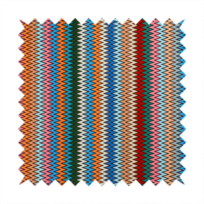 A vibrant fabric pattern featuring tight vertical rows of colourful zigzag lines in shades of orange, pink, blue, red, green, and beige.
