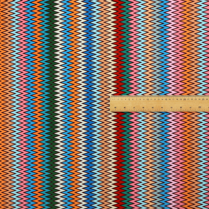 A vibrant fabric pattern featuring tight vertical rows of colourful zigzag lines in shades of orange, pink, blue, red, green, and beige.