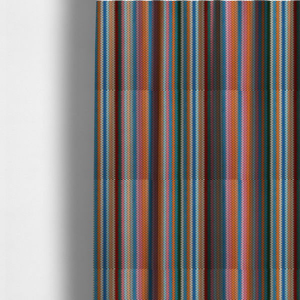 The fabric used to create these made-to-measure curtains is a vibrant fabric pattern featuring tight vertical rows of colourful zigzag lines in shades of orange, pink, blue, red, green, and beige.