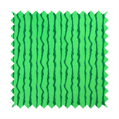 A playful fabric pattern featuring vertical wavy dark green stripes running across a bright green background.