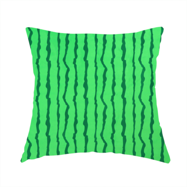 The fabric used to create this handmade cushion is a playful fabric pattern featuring vertical wavy dark green stripes running across a bright green background.