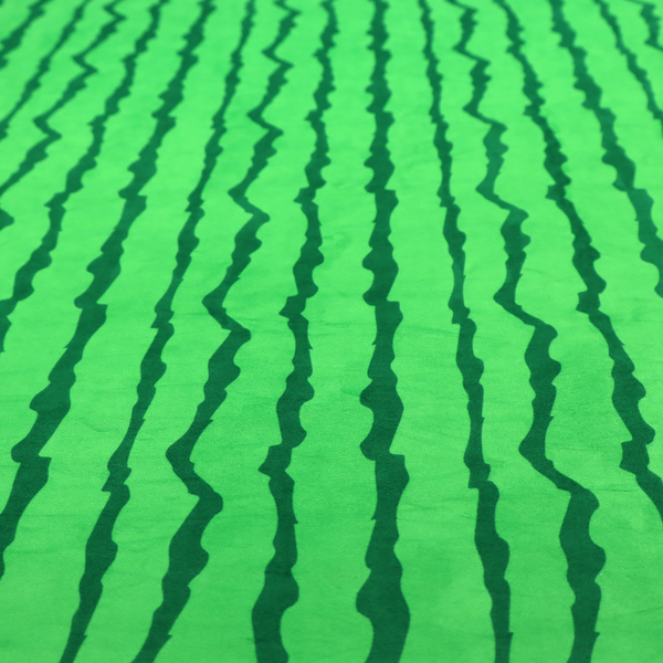 A playful fabric pattern featuring vertical wavy dark green stripes running across a bright green background.