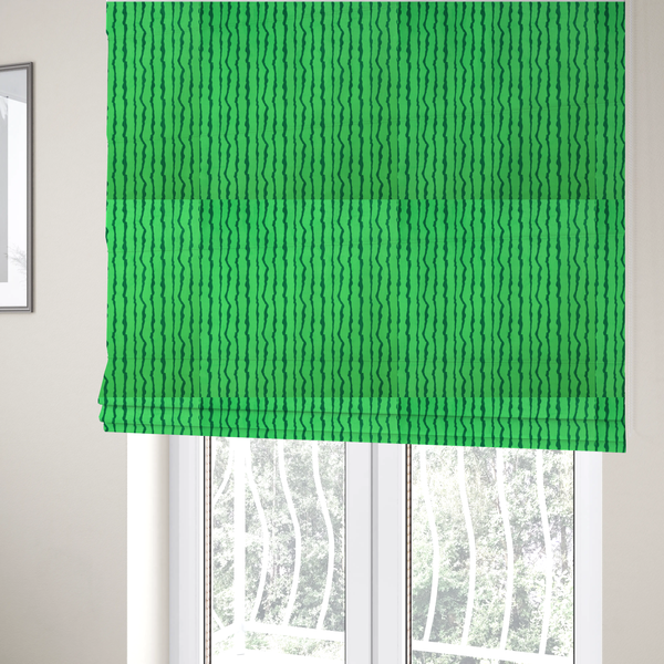 The fabric used to create these Roman blinds is a playful fabric pattern featuring vertical wavy dark green stripes running across a bright green background.