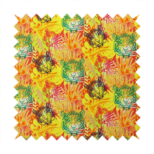 The image features a vibrant, repeating tropical pattern set against a bright yellow and orange background. The design is filled with stylized jungle foliage, including overlapping palm fronds and leaves. Interspersed throughout the pattern are illustrative tiger faces rendered in different colours, including striking shades of green, dark blue, and pinkish-red.   
