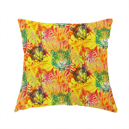 The fabric used to create this handmade cushion features a vibrant, repeating tropical pattern set against a bright yellow and orange background. The design is filled with stylized jungle foliage, including overlapping palm fronds and leaves. Interspersed throughout the pattern are illustrative tiger faces rendered in different colours, including striking shades of green, dark blue, and pinkish-red.   