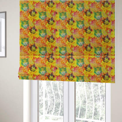 The fabric used to create these Roman blinds features a vibrant, repeating tropical pattern set against a bright yellow and orange background. The design is filled with stylized jungle foliage, including overlapping palm fronds and leaves. Interspersed throughout the pattern are illustrative tiger faces rendered in different colours, including striking shades of green, dark blue, and pinkish-red.   
