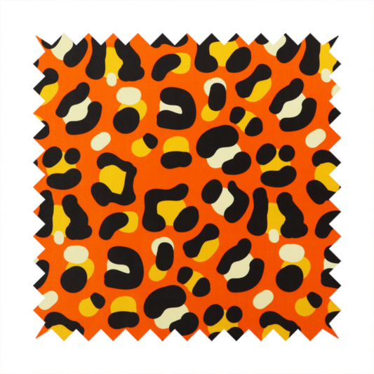 The image features a bold leopard print upholstery fabric in a vibrant orange background with black spots featuring yellow and cream highlights.   