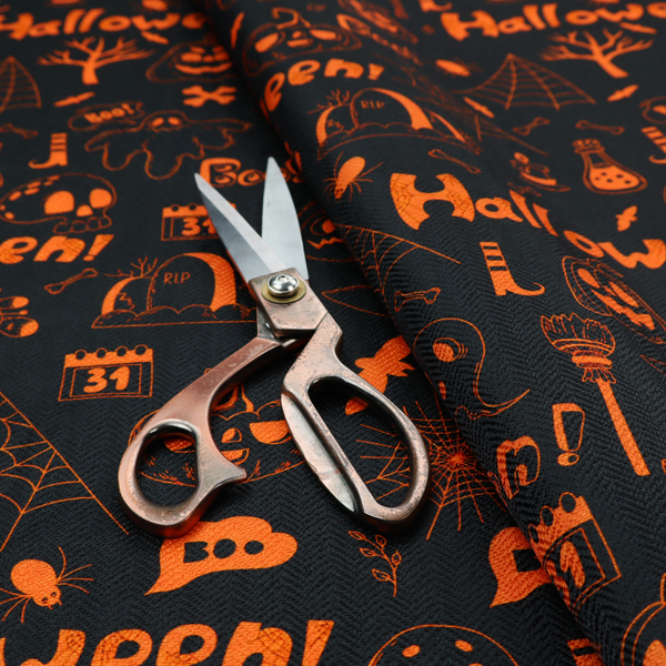 The image features a Halloween-themed repeating pattern set against a black background. The design is filled with spooky orange illustrations, including jack-o'-lanterns, ghosts, skulls, bats, spiderwebs, tombstones, witch hats, and the text "Halloween" and "Boo!"   