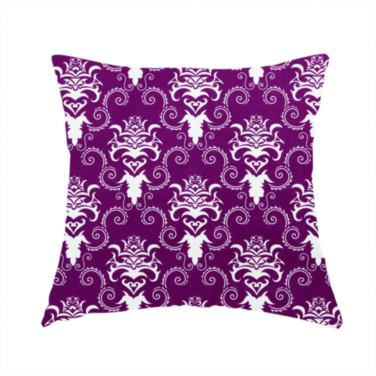 The fabric used to create this handmade cushion features an ornate, repeating damask pattern in white set against a rich purple background.