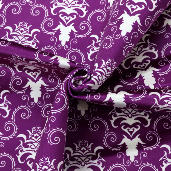 The image features an ornate, repeating damask pattern in white set against a rich purple background.