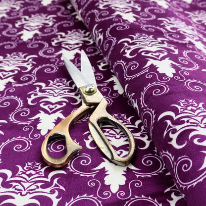 The image features an ornate, repeating damask pattern in white set against a rich purple background.