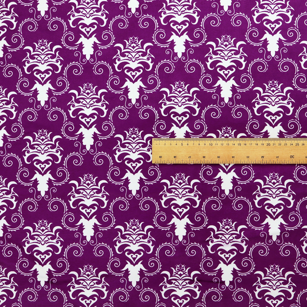 The image features an ornate, repeating damask pattern in white set against a rich purple background.