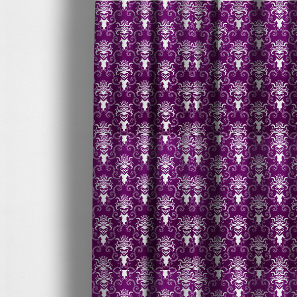 The fabric used to create these made-to-measure curtains features an ornate, repeating damask pattern in white set against a rich purple background.