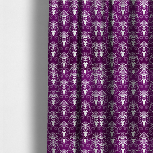 The fabric used to create these made-to-measure curtains features an ornate, repeating damask pattern in white set against a rich purple background.