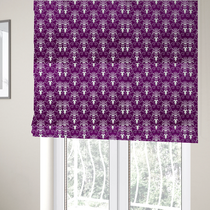 The fabric used to create these Roman blinds features an ornate, repeating damask pattern in white set against a rich purple background.