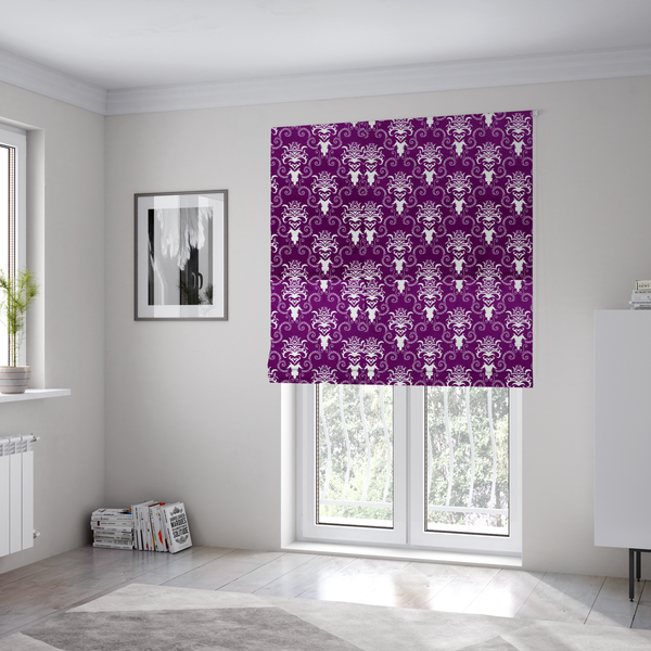 The fabric used to create these Roman blinds features an ornate, repeating damask pattern in white set against a rich purple background.