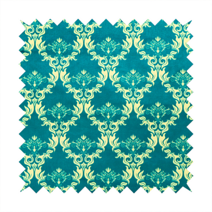 The image features an intricate, repeating damask pattern in a light cream colour set against a textured teal background.   