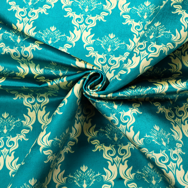 The image features an intricate, repeating damask pattern in a light cream colour set against a textured teal background.   