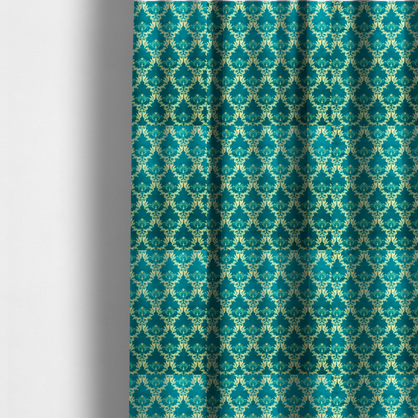 The fabric used to create these made-to-measure curtains features an intricate, repeating damask pattern in a light cream colour set against a textured teal background.   