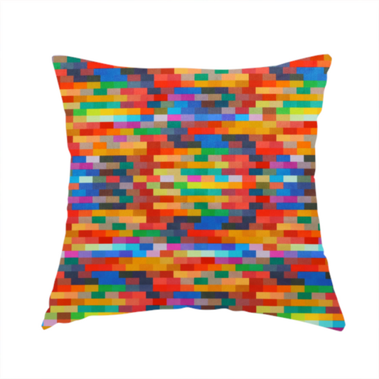 The fabric used to create this handmade cushion features a colourful, mosaic-like pattern made up of small, horizontal rectangular blocks in a wide variety of bright colours, including red, orange, yellow, blue, green, and purple.   