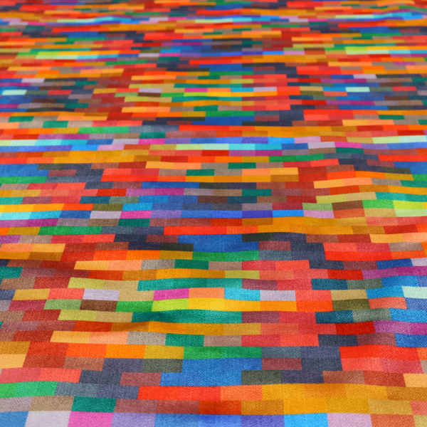 The image features a colourful, mosaic-like pattern made up of small, horizontal rectangular blocks in a wide variety of bright colours, including red, orange, yellow, blue, green, and purple.   