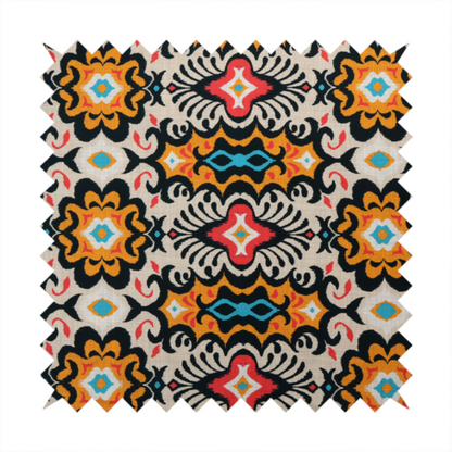 The image features a vibrant, symmetrical ikat-style pattern set against a light background. The design includes elaborate floral motifs and geometric shapes in striking shades of black, orange, yellow, bright red, and turquoise.   