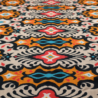 The image features a vibrant, symmetrical ikat-style pattern set against a light background. The design includes elaborate floral motifs and geometric shapes in striking shades of black, orange, yellow, bright red, and turquoise.   