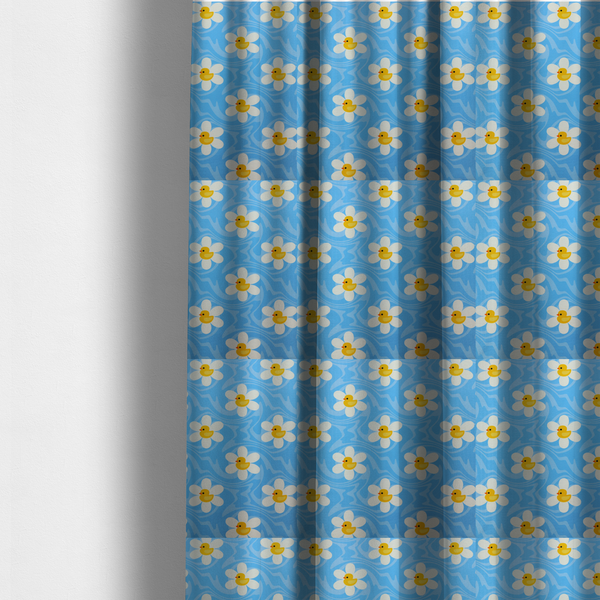 the fabric used to create these made-to-measure curtains features a repeating pattern of white daisies with yellow centres shaped like little rubber ducks, all set against a wavy blue background.   
