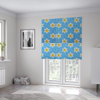 The fabric used to create these Roman blinds features a repeating pattern of white daisies with yellow centres shaped like little rubber ducks, all set against a wavy blue background.   