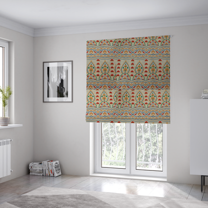 The fabric used to create these Roman blinds features an intricate, traditional-style repeating pattern set against a light, neutral background. The design incorporates teardrop-shaped paisley motifs, arched borders, and horizontal bands filled with floral details in shades of orange, blue, green, and red.   