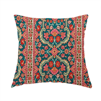 The fabric used to create this handmade cushion features a vertical striped pattern filled with ornate floral and botanical motifs, set against a rich teal background. The intricate design includes scrolling vines and blossoms in shades of pink, red, and cream.